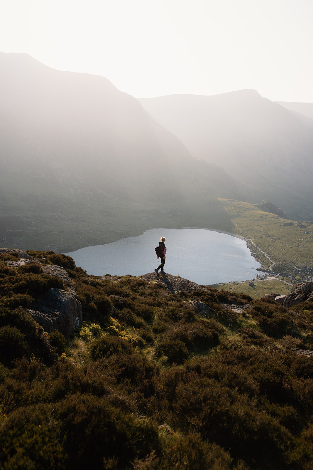 Charli overlooking mountain lake